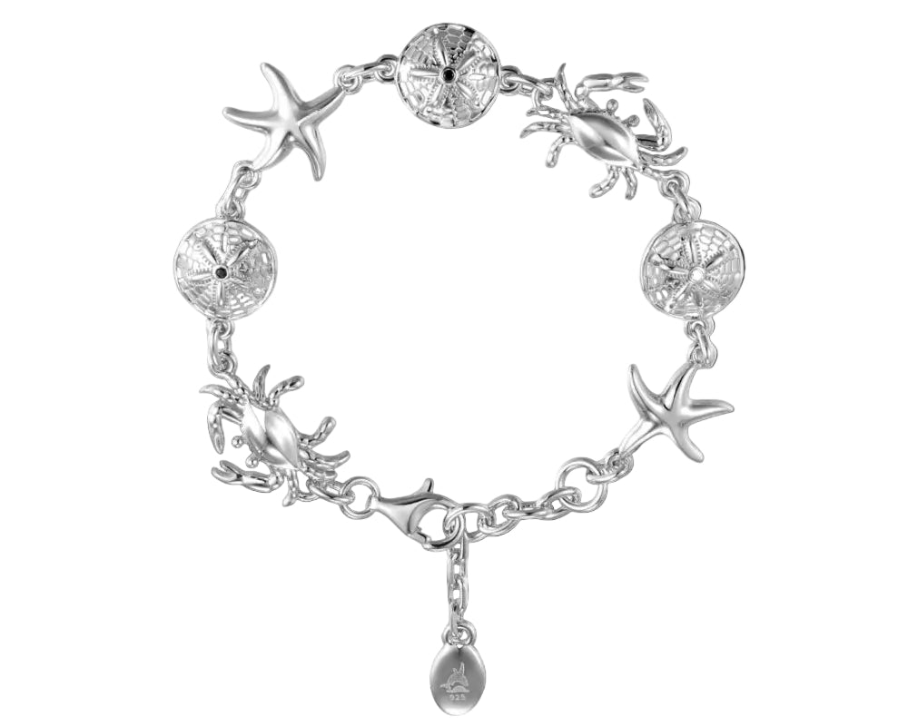 A silver-toned bracelet featuring sea-themed charms including starfish, crabs, sand dollars.