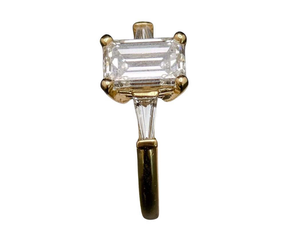 1.50 Emerald Cut Diamond Ring With Baguette Accent Diamonds - Yellow Gold